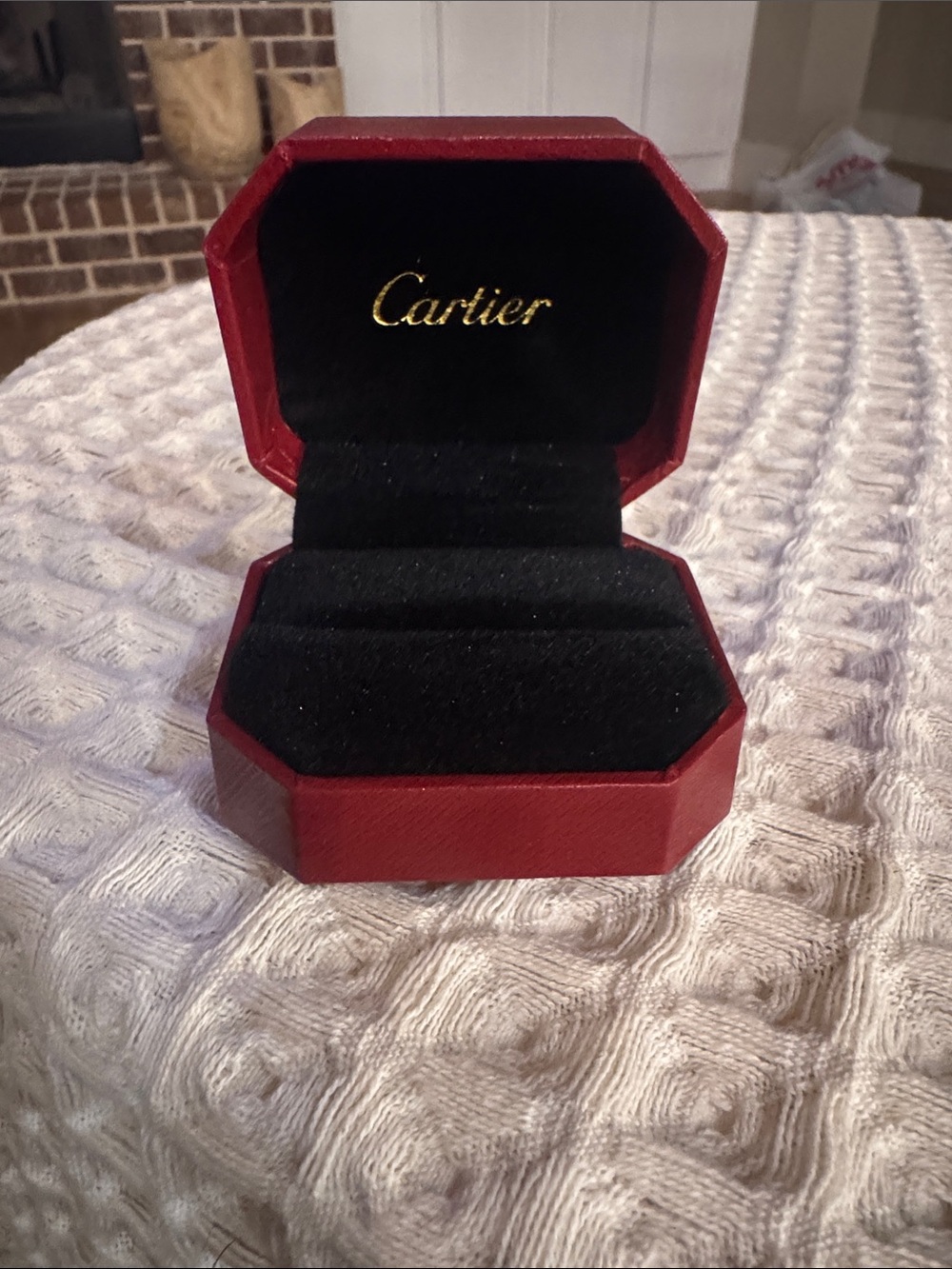 red jewelry ring box with black interior